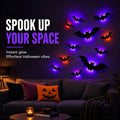 Glowing 3D LED bat lights on a living room wall above a sofa