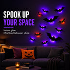 Glowing 3D LED bat lights on a living room wall above a sofa